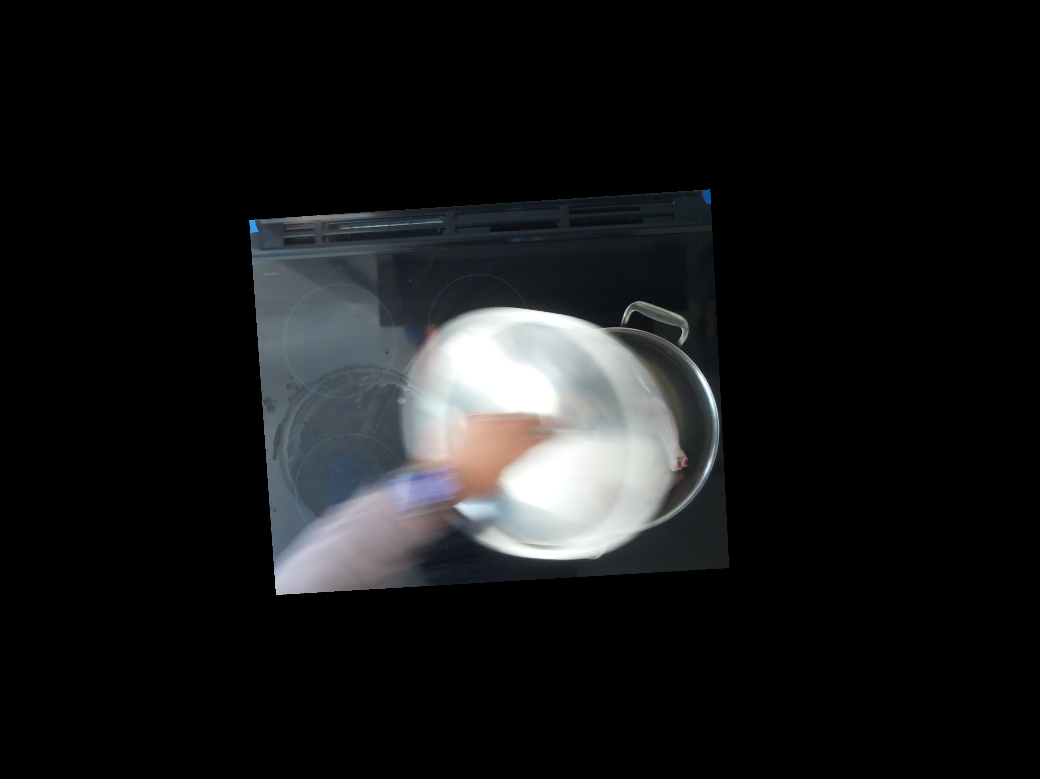 A lid being lifted off a pot of chicken